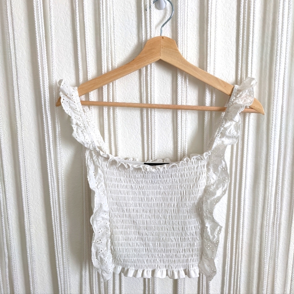 White eyelet smocked ruffle tank